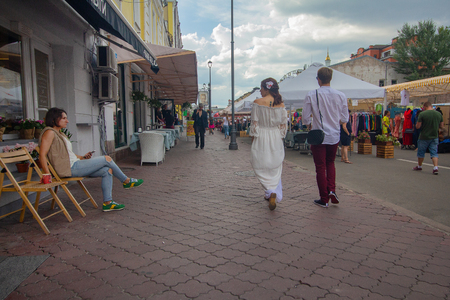 Kiev, Ukraine - July 13, 2018: Townspeople and tourists near the fair and street cafeのeditorial素材