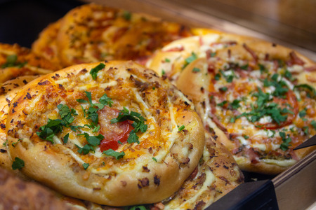 Round pizza on the shop counter. Food