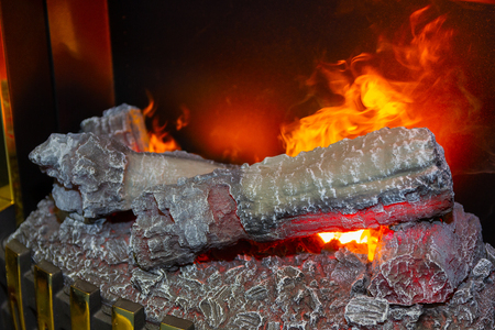 Fire burns in a fireplaceの写真素材