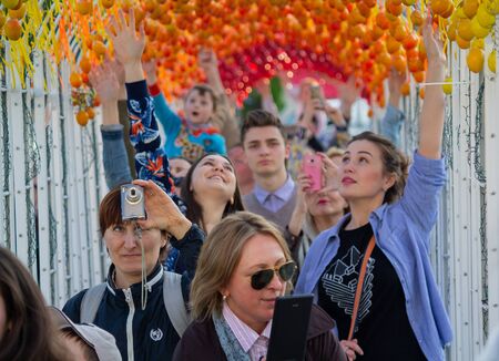 Kiev, Ukraine - May 01, 2016: People walk through the symbolic tunnel of Easter eggs during the Easter celebrationのeditorial素材