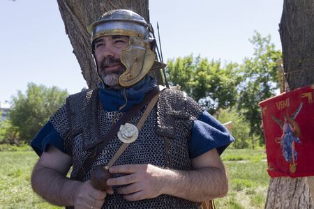Kiev, Ukraine - May 27, 2018: Man in the armor of a Roman regioner at a festival of historical...