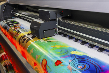 Large format printing machine in operation. Industryの写真素材