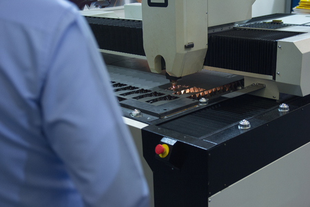 Worker in the industrial laser cutting of sheet metal. Industry