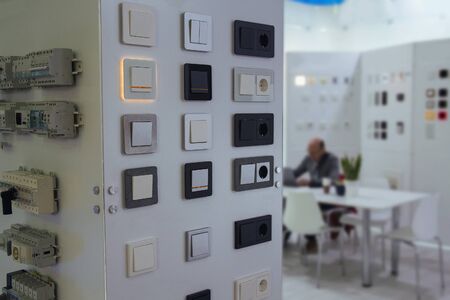 Electrical household switches and sockets on the stand in the store.