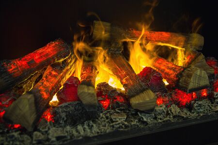 Wood burning in the fireplace closeup. Home