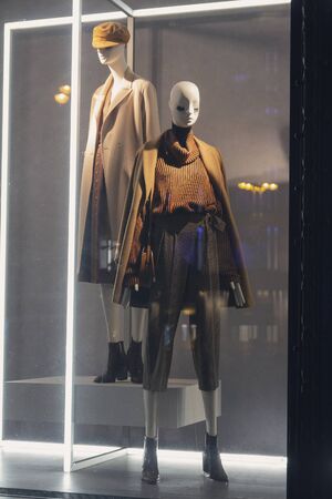 Female mannequins in trendy clothes in the shop windowの写真素材