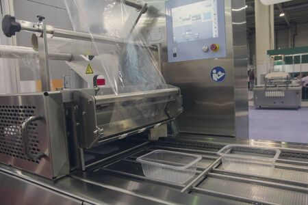 Machine for packing food products close-up. Industry
