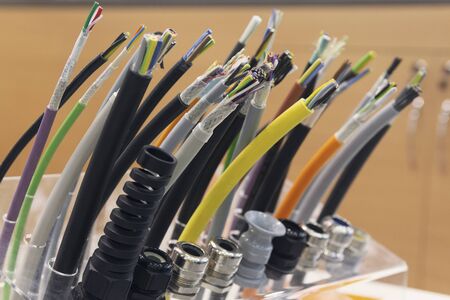 Different separation power cables on the showcase close up. Industry