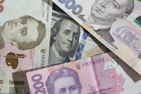 Ukrainian money - hryvnia banknotes USA dollars bills. Finance in Ukraine, of the hryvnia to the dollar exchange rateの写真素材