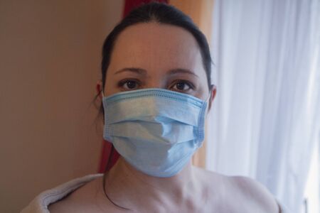 Serious woman in a protective mask. Peopleの写真素材