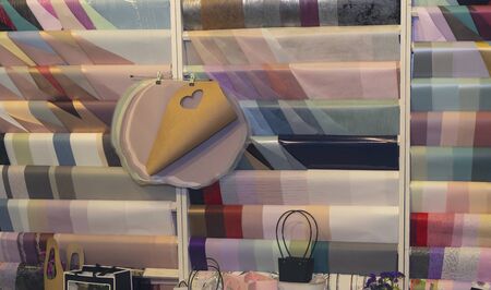 Multicolored wrapping paper on the shop counter. Presentsの写真素材
