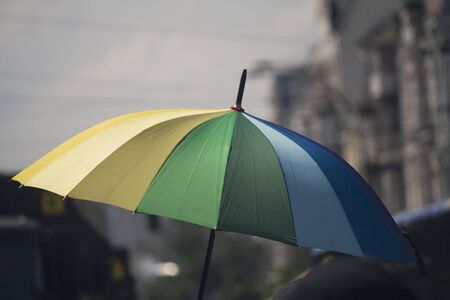 Rainbow flag umbrella at pride parade. Lgbtの写真素材
