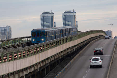 Kiev, Ukraine - August 20, 2019: Metro bridge and road across the Dnipro River connecting the right and left bank of Kievのeditorial素材