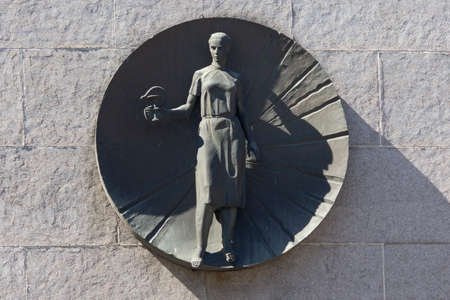 Kiev, Ukraine -April 06, 2020: Bas-relief with a female medic on the front of the hospitalのeditorial素材