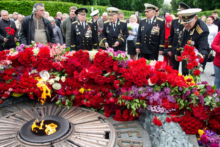 Kiev, Ukraine - May 09, 2019: World War II veterans laid flowers at the monument to fallen soldierのeditorial素材