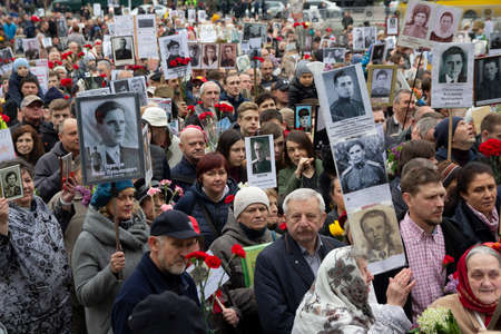 Kiev, Ukraine - May 09, 2019: Citizens with portraits of the ancestors who died - warriors on the march on the anniversary of the victory in World War IIのeditorial素材