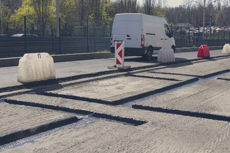 City road repair in asphalt pavement. Industry