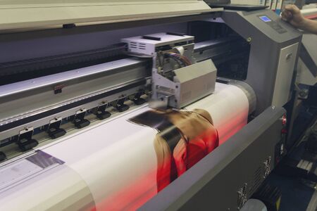 Large format printing machine in operation. Industry