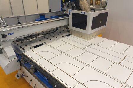 Machine tools format cutting are cut chipboard furniture in the shop. Industryの写真素材