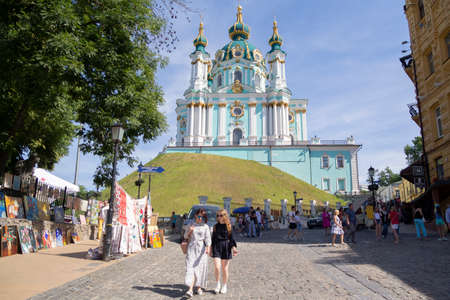 Kiev, Ukraine - June 10, 2018. Andreevsky descent in Kiev - is one of the ancient ways connecting the Upper city, its central part, with the trading Podol. St. Andrew's Churchのeditorial素材