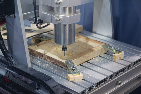 Wood carving machine. Modern automatic woodworking machine with CNC. Furniture production.の写真素材