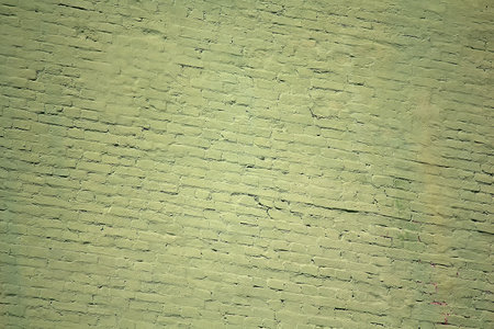 Old green color brick wall. Backgrounds and texturesの写真素材