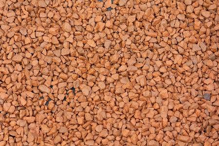 A pile of colorful red and brown rubble. Backgrounds and textureの写真素材