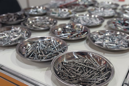 Silver blind rivet screw rivets for hand rivets in a store window. Industryの写真素材