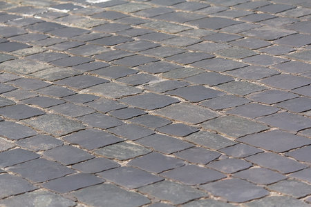 Gray square cobble stone paving perspective. Background and textureの写真素材