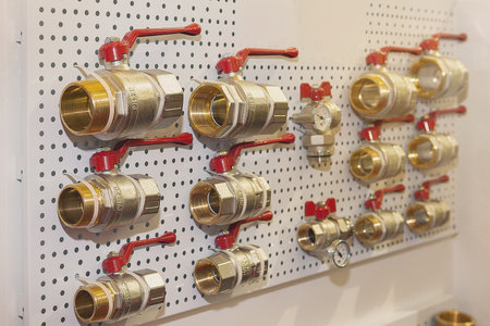 Range of metal ball valves on display in the store. Industryの写真素材