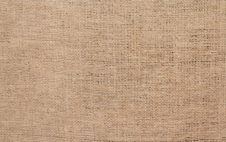 Very coarse, rough fabric woven made of flax, jute or hemp. Backgrounds and texturesの写真素材