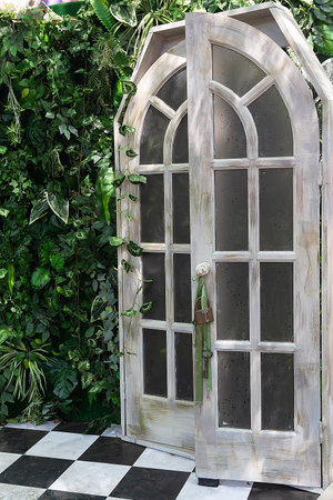 Garden and arch with natural greenery in nature for venue. Wedding decorations