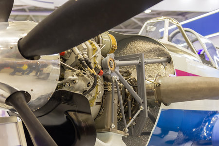 Open engine compartment of an airplane at an aviation exhibition. Air transport