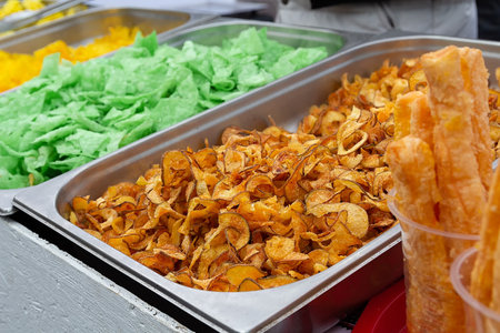 Delicious colorful chips on the store counter. Foodの写真素材