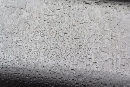 Raindrops on a metal surface close-up. Backgroundsの写真素材