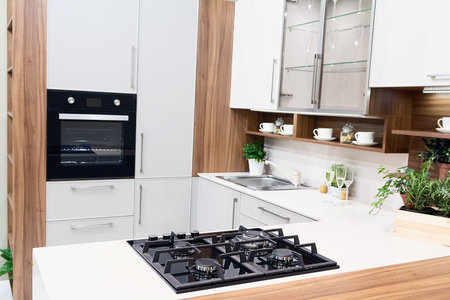 Home kitchen with white cabinets and an island. Interiorの写真素材
