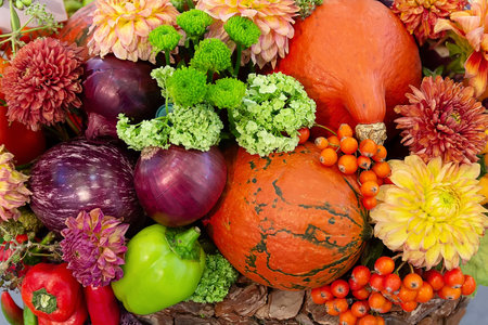 Festive autumn decor from pumpkins, berries and flowersの写真素材