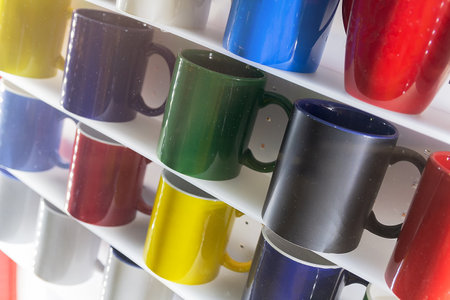 Colorful mug stall in a store closeup. Industryの写真素材