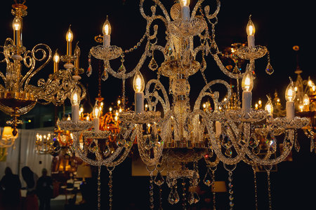 Luxury chandelier in lighting store on a dark background. Interiorの写真素材