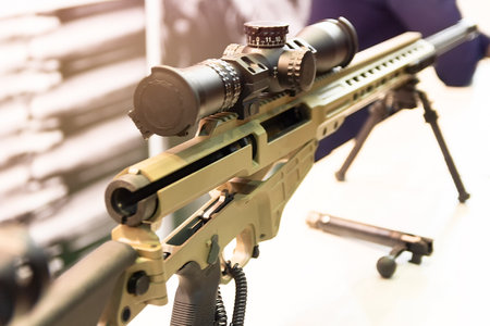 An automatic rifle with an optical sight on the counter. Weapon