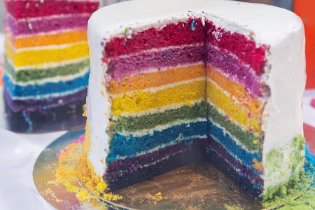 Beautiful multi-colored cake in a showcase. Festive dessertの写真素材