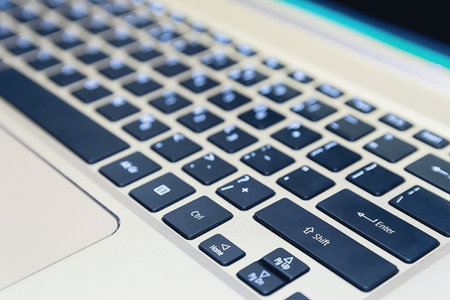 Close-up of a laptop keyboard. Office backgroundの写真素材