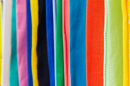 Colorful fabrics hang in a row. Textile industryの写真素材