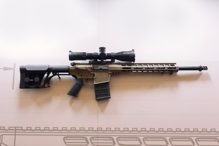 Modern automatic rifle on the window.の写真素材