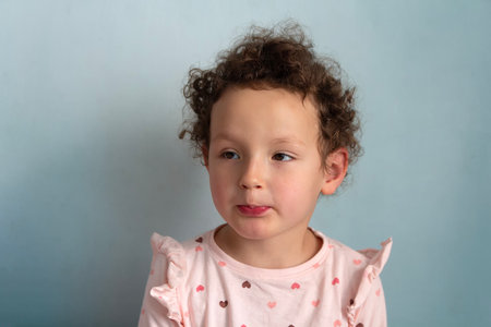 Portrait of a beautiful curly child. People