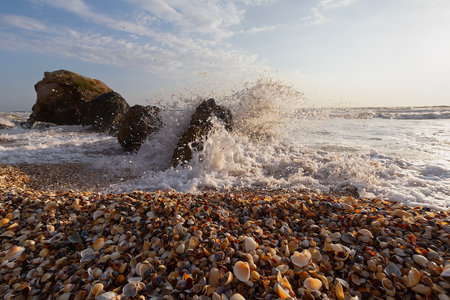 Waves collide with stones on the seashore. Crimeaの写真素材