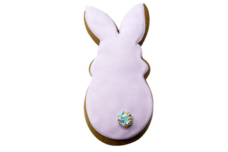 Easter gingerbread in the form of a pink rabbit isolated on a white backgroundの写真素材