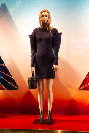 Female mannequins and fashion accessories in store windows. Sale