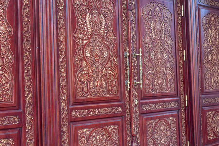 Carved wooden door in the oriental style close-upの写真素材