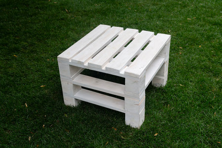Simple wooden white stool on the lawn. Relaxの写真素材